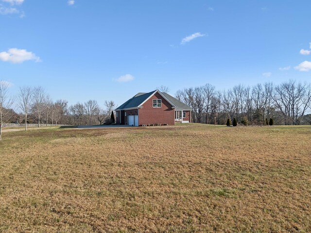 6611 Arno College Grove Rd, College Grove, TN 37046 - view of grassy yard featuring asphalt driveway