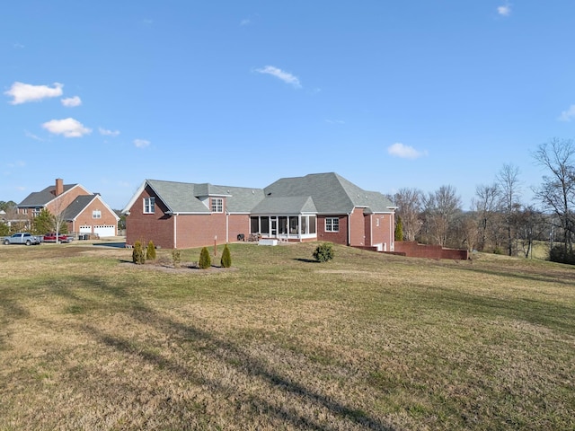 6611 Arno College Grove Rd, College Grove, TN 37046 - rear view of house featuring a lawn and brick siding