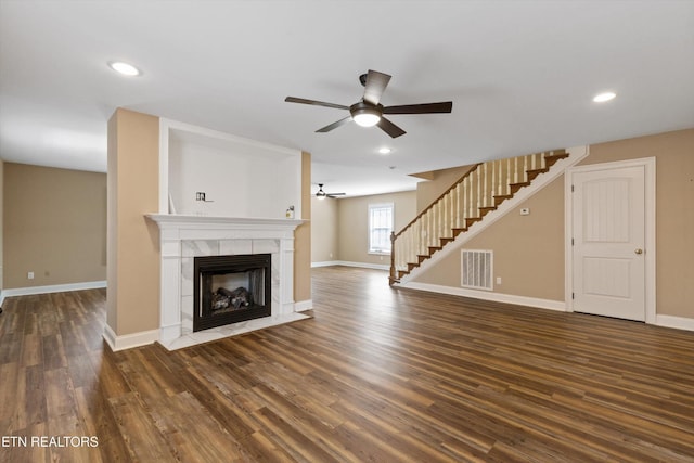 338 Lindsey Mill Cir, Rocky Top, TN 37769 - unfurnished living room featuring ceiling fan, stairs, baseboards, wood finished floors, and recessed lighting