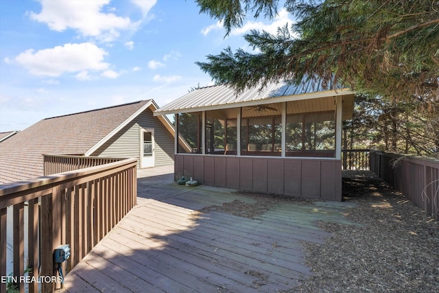 338 Lindsey Mill Cir, Rocky Top, TN 37769 - wooden terrace featuring a sunroom and fence