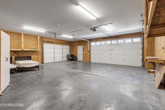338 Lindsey Mill Cir, Rocky Top, TN 37769 - garage featuring a garage door opener
