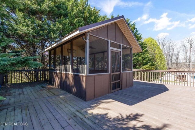 338 Lindsey Mill Cir, Rocky Top, TN 37769 - wooden deck featuring a sunroom