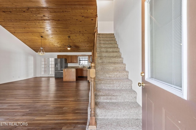 338 Lindsey Mill Cir, Rocky Top, TN 37769 - stairs with lofted ceiling, wood finished floors, wooden ceiling, a ceiling fan, and a chandelier