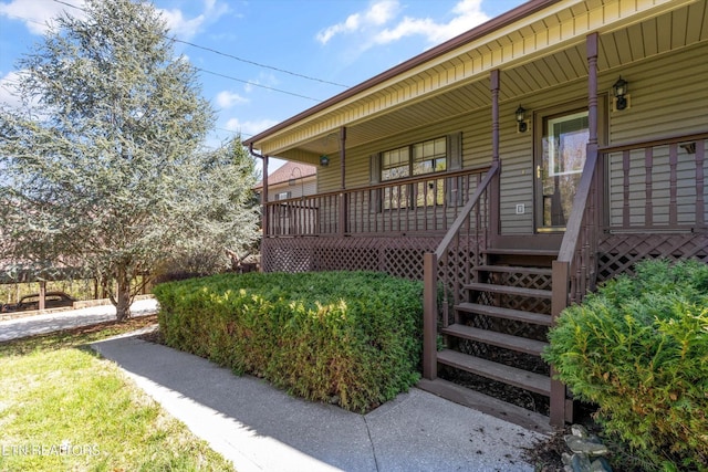 338 Lindsey Mill Cir, Rocky Top, TN 37769 - view of home's exterior featuring covered porch and board and batten siding