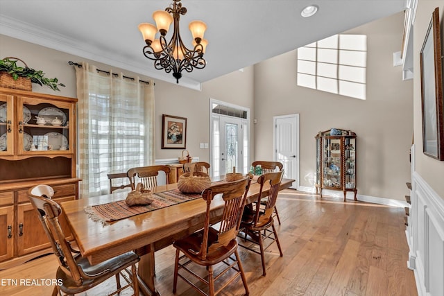 5606 Bridgehampton Dr, Powell, TN 37849 - dining area featuring a chandelier, light wood-style floors, and ornamental molding