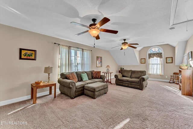 5606 Bridgehampton Dr, Powell, TN 37849 - carpeted living room with attic access, ceiling fan, baseboards, vaulted ceiling, and a textured ceiling