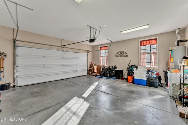 5606 Bridgehampton Dr, Powell, TN 37849 - garage featuring gas water heater and a garage door opener