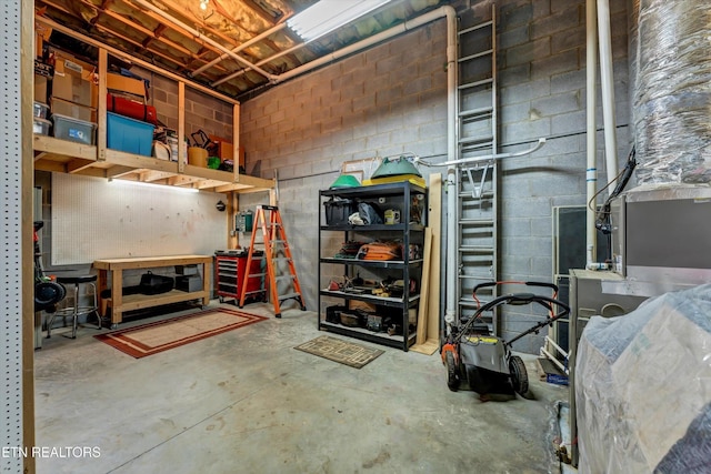 5606 Bridgehampton Dr, Powell, TN 37849 - garage featuring a workshop area and concrete block wall