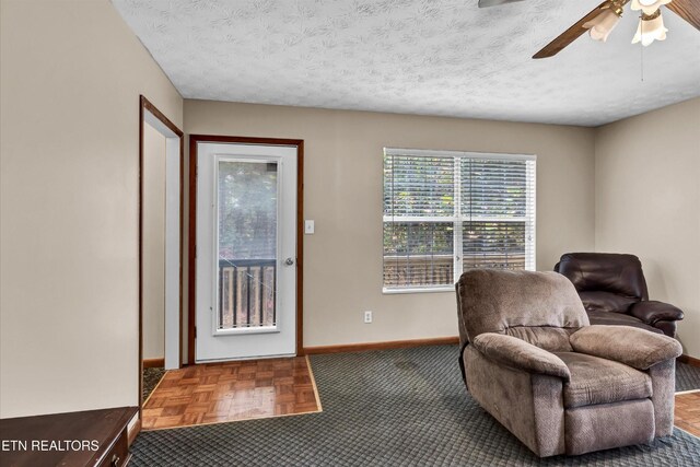 2406 Rowena Ln, Knoxville, TN 37931 - sitting room with baseboards, ceiling fan, and a textured ceiling