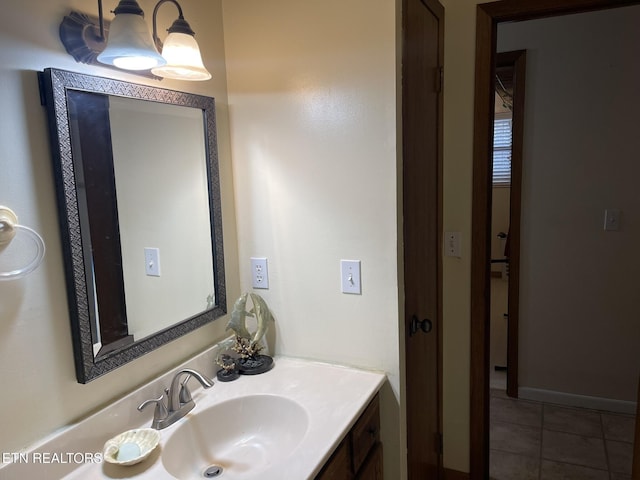 bathroom with tile patterned flooring and vanity