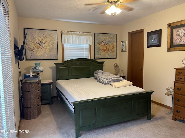bedroom with light colored carpet and ceiling fan