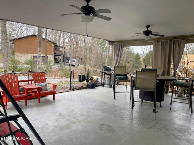view of patio with ceiling fan and outdoor dining area