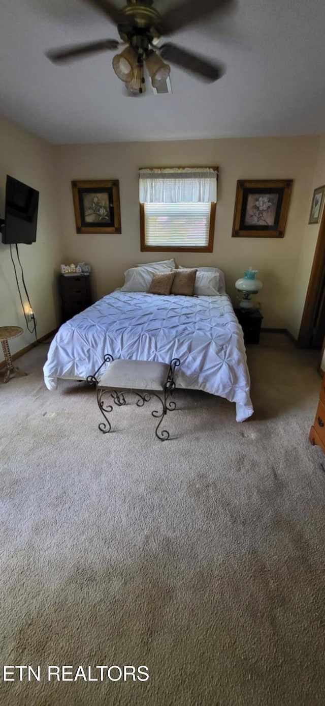 bedroom featuring carpet flooring and a ceiling fan