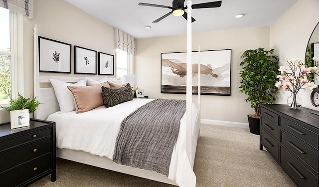 bedroom featuring light colored carpet, baseboards, ceiling fan, and recessed lighting