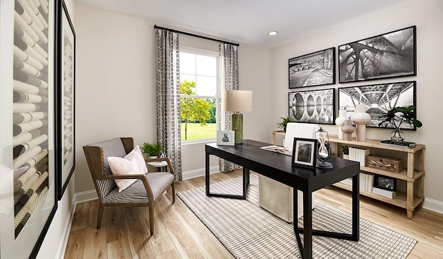office featuring baseboards, light wood finished floors, and recessed lighting