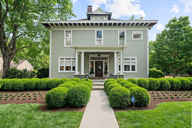 traditional style home featuring a chimney