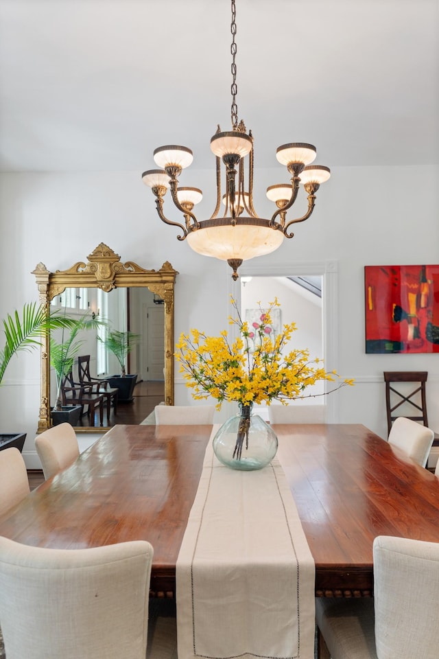 dining space featuring a chandelier