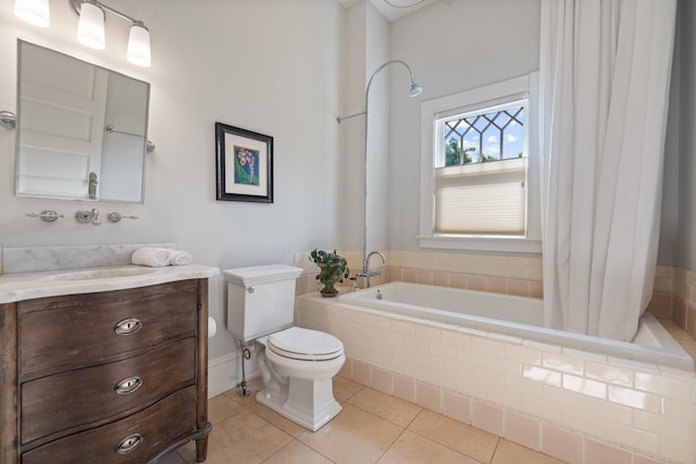 full bathroom with toilet, tile patterned floors, tiled shower / bath, and vanity
