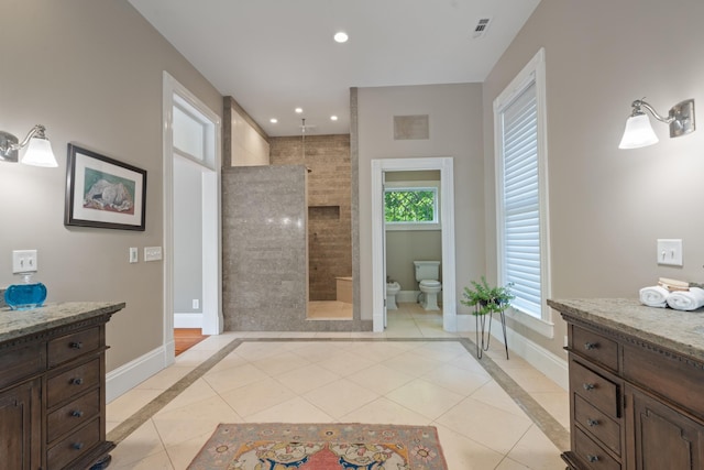 bathroom with baseboards, walk in shower, inlaid floor details, recessed lighting, and toilet
