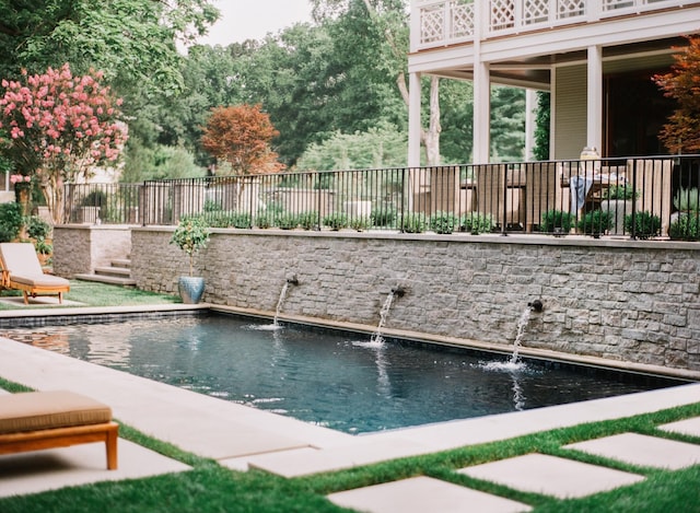 view of pool with fence