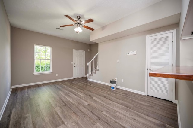 2642 Sewanee Pl, Murfreesboro, TN 37128 - unfurnished living room featuring stairs, wood finished floors, ceiling fan, and baseboards