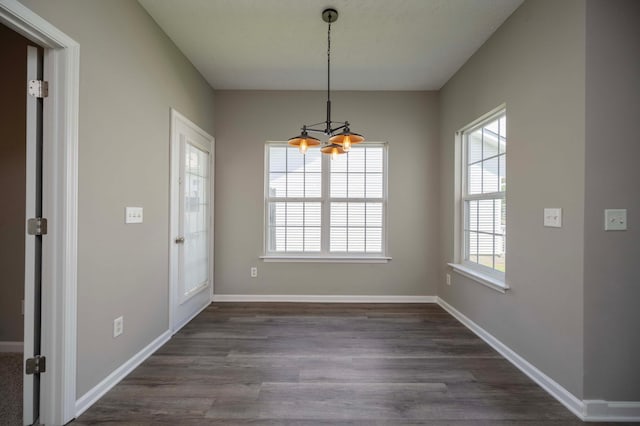2642 Sewanee Pl, Murfreesboro, TN 37128 - unfurnished dining area with a chandelier, dark wood-type flooring, and baseboards