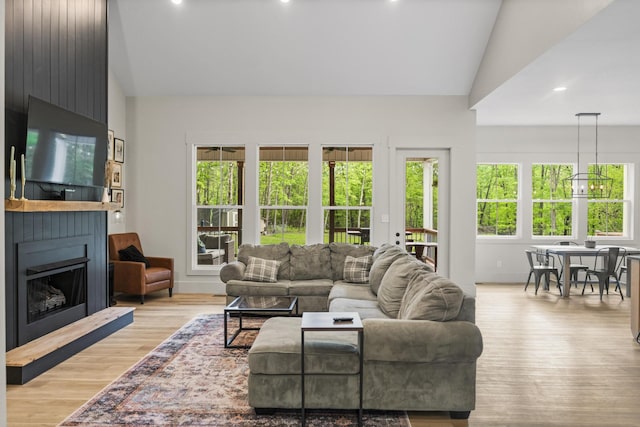12684 US Highway 41, Tracy City, TN 37387 - living room featuring lofted ceiling, a large fireplace, light wood-type flooring, and recessed lighting