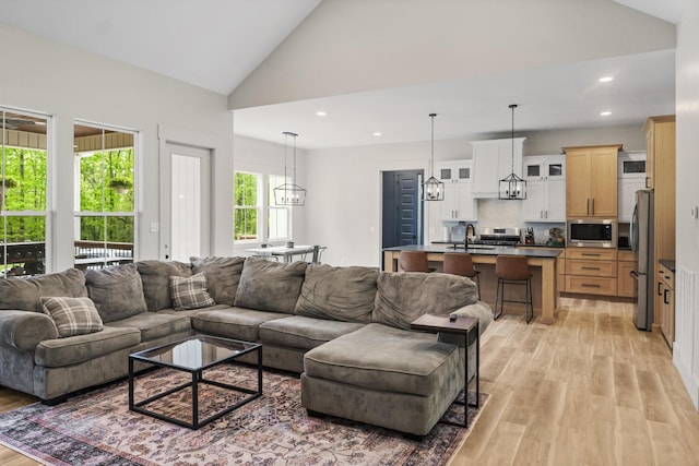 12684 US Highway 41, Tracy City, TN 37387 - living area with light wood-style flooring, recessed lighting, a chandelier, and high vaulted ceiling