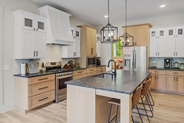 12684 US Highway 41, Tracy City, TN 37387 - kitchen with stainless steel appliances, a sink, decorative backsplash, light wood-style flooring, and recessed lighting