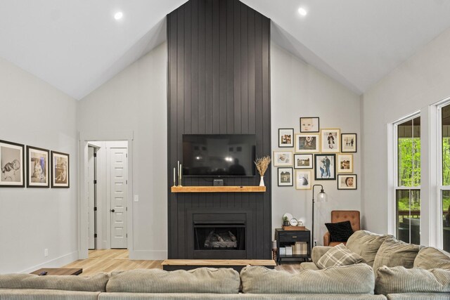 12684 US Highway 41, Tracy City, TN 37387 - living room featuring high vaulted ceiling, wood finished floors, baseboards, and a large fireplace