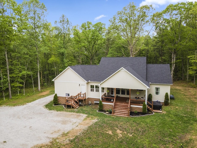 12684 US Highway 41, Tracy City, TN 37387 - back of property featuring a shingled roof, stairs, a wooded view, and a lawn