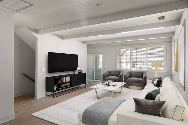 living area featuring wood finished floors and baseboards