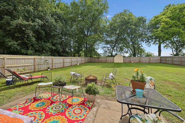 405 Mockingbird Dr, Mount Pleasant, TN 38474 - view of patio with a storage shed, an outdoor fire pit, and an outdoor structure