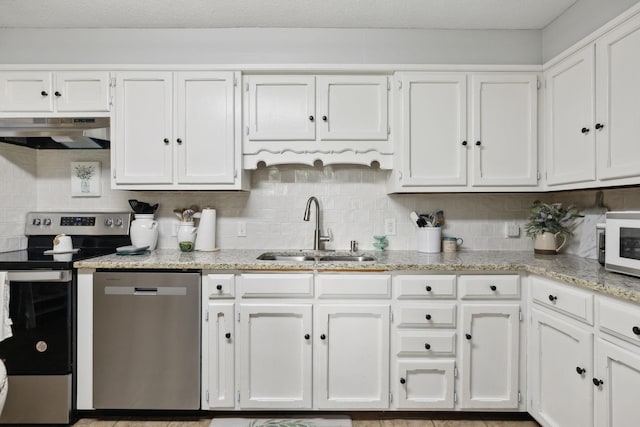405 Mockingbird Dr, Mount Pleasant, TN 38474 - kitchen featuring stainless steel appliances, under cabinet range hood, a sink, and white cabinetry