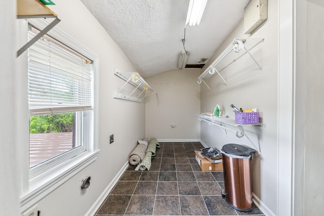 2046 Scribners Mill Rd, Culleoka, TN 38451 - clothes washing area with baseboards and a textured ceiling