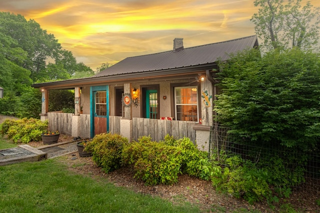 2046 Scribners Mill Rd, Culleoka, TN 38451 - view of front of home featuring covered porch, metal roof, and a chimney