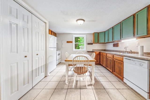 2046 Scribners Mill Rd, Culleoka, TN 38451 - kitchen with white appliances, a sink, a textured ceiling, green cabinets, and light tile patterned floors