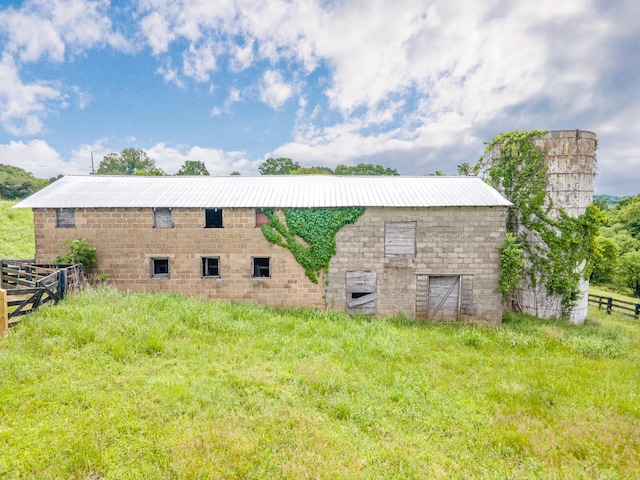 2046 Scribners Mill Rd, Culleoka, TN 38451 - view of side of home with fence, an outdoor structure, metal roof, and a barn