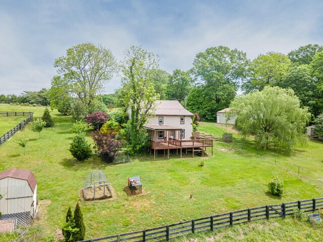 2046 Scribners Mill Rd, Culleoka, TN 38451 - view of yard featuring a deck, an outdoor structure, a storage unit, a garden, and a view of rural / pastoral area