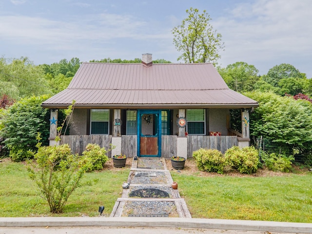 2046 Scribners Mill Rd, Culleoka, TN 38451 - view of front of home with covered porch, a front yard, metal roof, and stucco siding
