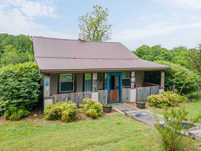 2046 Scribners Mill Rd, Culleoka, TN 38451 - view of front of property featuring covered porch, metal roof, a front yard, and a chimney