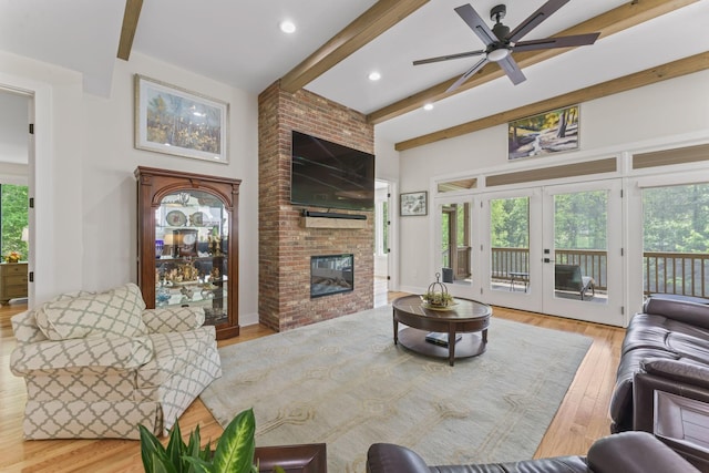 304 Cedar Hollow Ct, Lebanon, TN 37087 - living area with beamed ceiling, wood finished floors, a brick fireplace, a ceiling fan, and recessed lighting
