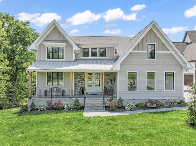 304 Cedar Hollow Ct, Lebanon, TN 37087 - modern farmhouse with board and batten siding, a porch, a front lawn, and a standing seam roof