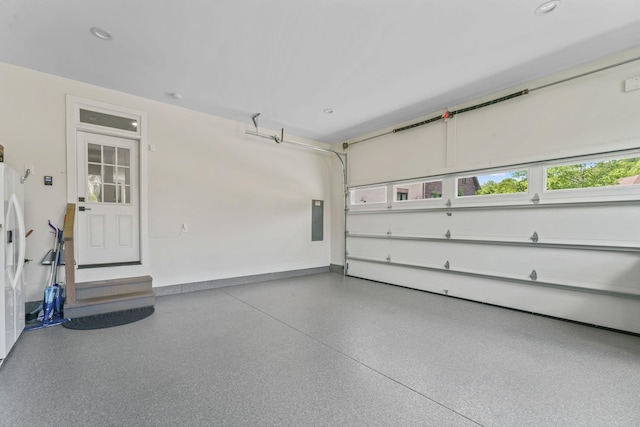 304 Cedar Hollow Ct, Lebanon, TN 37087 - garage with electric panel, baseboards, recessed lighting, and white fridge with ice dispenser