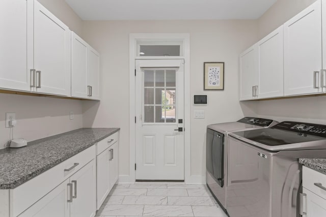 304 Cedar Hollow Ct, Lebanon, TN 37087 - washroom featuring washing machine and dryer, light marble finish flooring, cabinet space, and baseboards