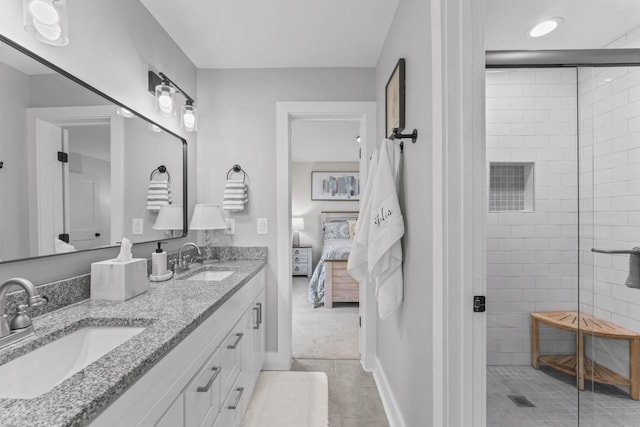 304 Cedar Hollow Ct, Lebanon, TN 37087 - full bathroom featuring tile patterned floors, a tile shower, connected bathroom, double vanity, and baseboards