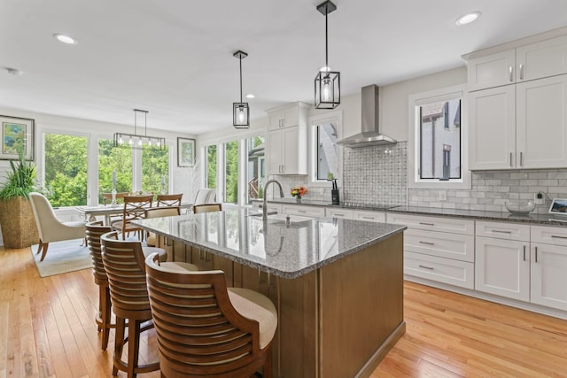 304 Cedar Hollow Ct, Lebanon, TN 37087 - kitchen with wall chimney range hood, a sink, black electric stovetop, healthy amount of natural light, and recessed lighting