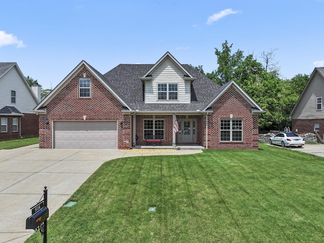 traditional-style home featuring concrete driveway, brick siding, a front yard, and a garage