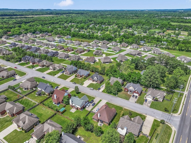 aerial view of property and surrounding area with nearby suburban area