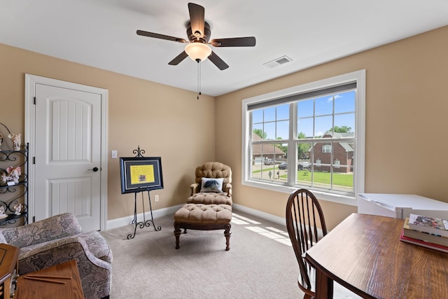 office space featuring carpet, ceiling fan, and baseboards
